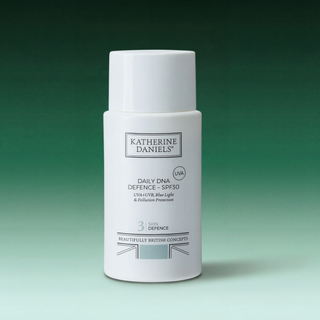 Katherine Daniels Daily DNA Defence SPF30 bottle on a gradient green background