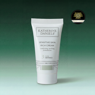 Katherine Daniels Sensitive Skin Rich Cream tube on a gradient green background